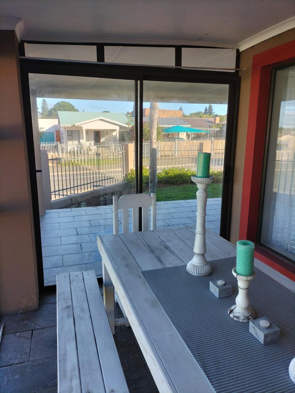 Covered patio table at Harbour Haven Guesthouse